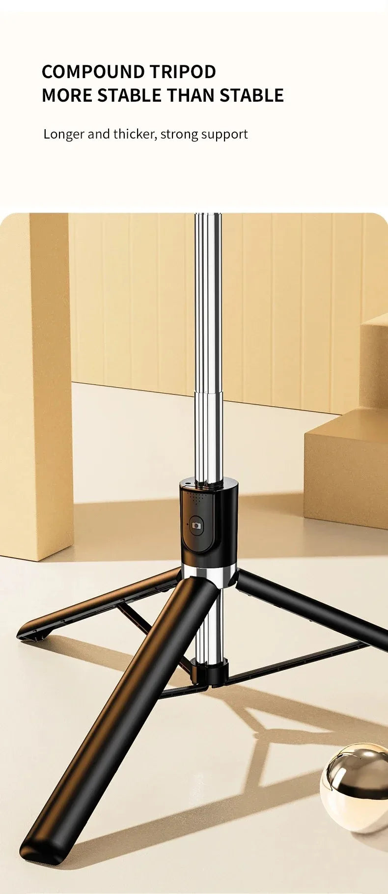 A black compound tripod stand with a long pole and crossbar is shown on a light surface.