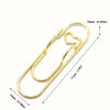 Gold-colored multifunctional magnetic pen clip with page marker shown against a white background.