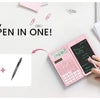A pink calculator with a stylus and pen are shown on a white desk next to a notebook and a laptop.