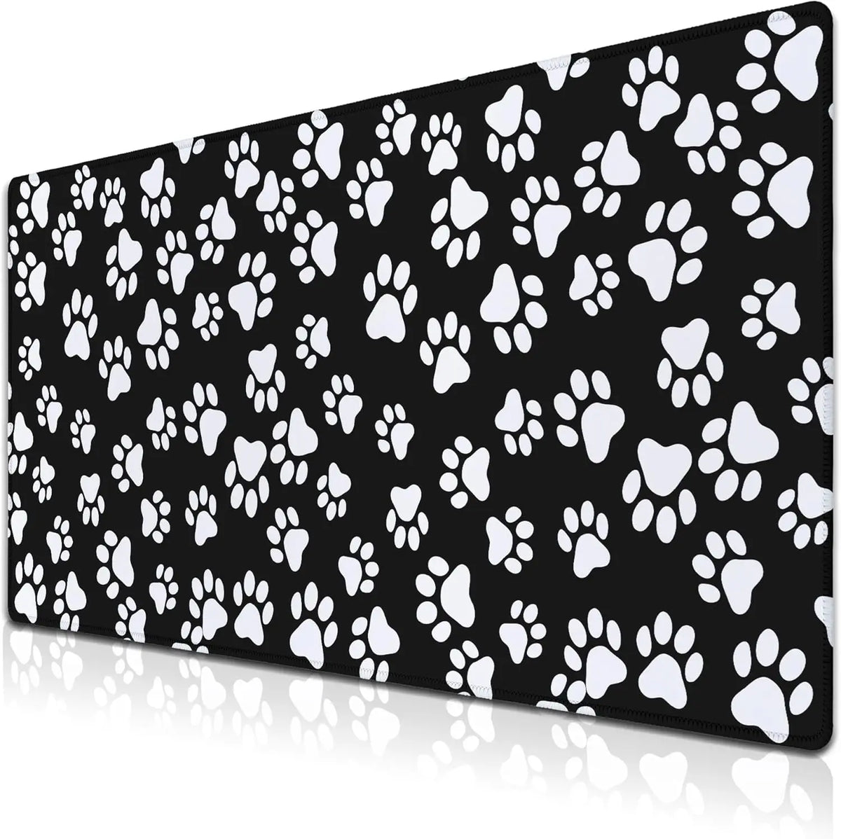 Black desk mat featuring a repeating pattern of white paw prints.
