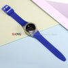 A blue silicone watch strap with a silver watch and replacement tools is displayed on a light background.