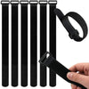 Black reusable hook and loop cable ties with a black strap shown being held by a hand