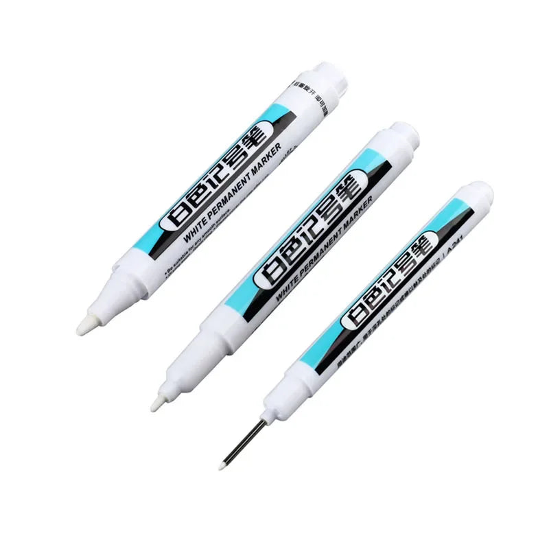 A pair of white permanent paint marker pens shown diagonally against a white background.