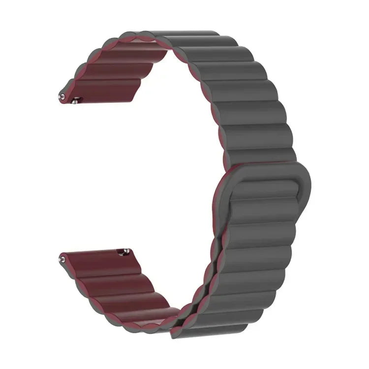 A close-up view of a dark gray adjustable magnetic loop watch band with reddish accents.