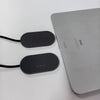 A silver iPad is shown next to its magnetic wireless charging adapter, which has three charging pins.
