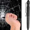 A hand is shown breaking a spiderweb on a black surface, demonstrating the tactical self-defense pen.