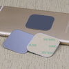 Two silver magnetic mount plates are shown resting on a smartphone.