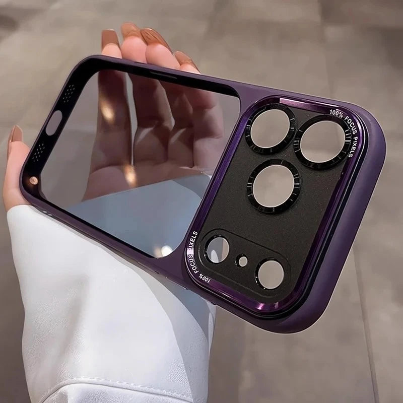 A hand holds a purple clear shockproof case with multiple camera lenses protecting an iPhone.
