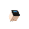 A beige wall charger with a charging indicator showing iPhone 11 Pro Max.