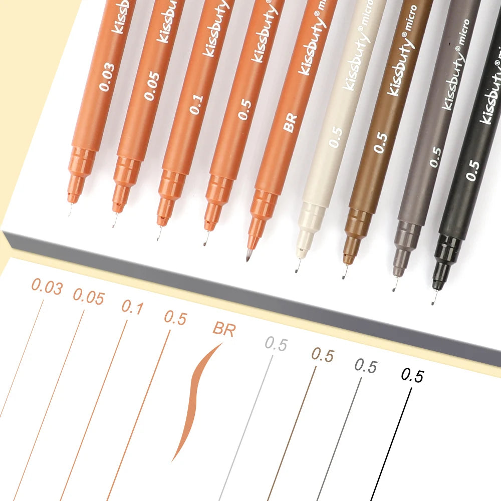 A collection of micro-pen fineliner pens in various shades and thicknesses, including orange, brown, and black.