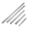 A precision double-sided stainless steel measuring ruler with millimeter markings.