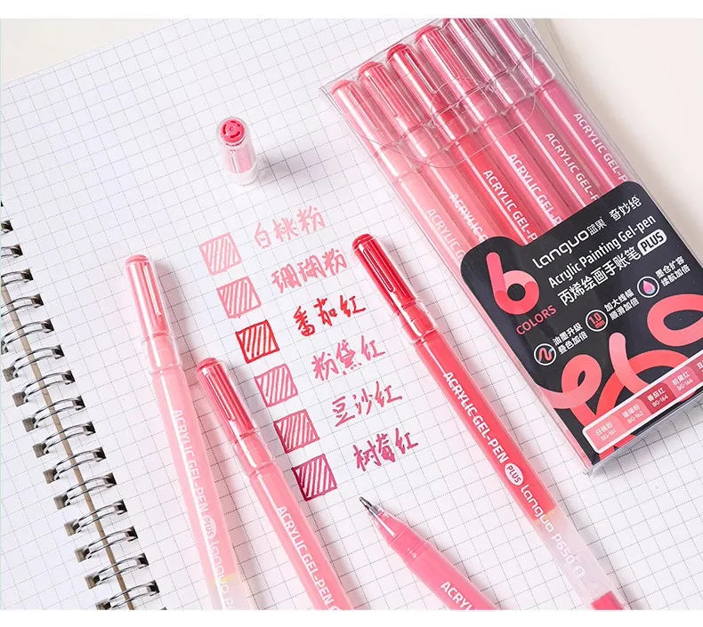 A set of multi-color acrylic painting gel pens in various shades displayed on a spiral notebook.