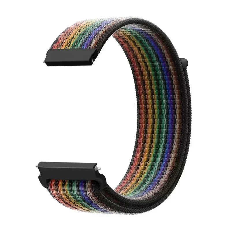 A close-up view of a colorful nylon loop watch strap with a black buckle.