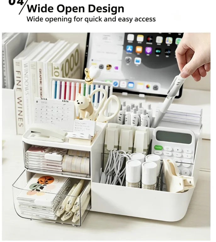 A white multifunctional desk organizer with clear storage drawers and various office supplies is shown on a light surface.