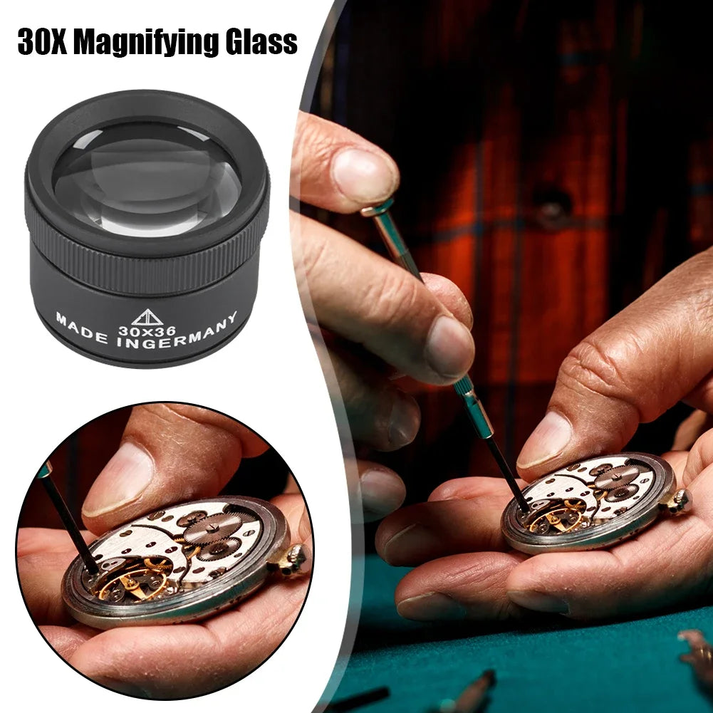 A close-up of a 30X magnifying glass being used to inspect jewelry and coins.