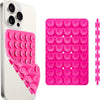 A white smartphone case and a pink silicone suction cup phone mount with multiple circular cups.