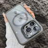 A hand holds a gray magnetic shockproof phone case for an iPhone displaying the Apple logo.