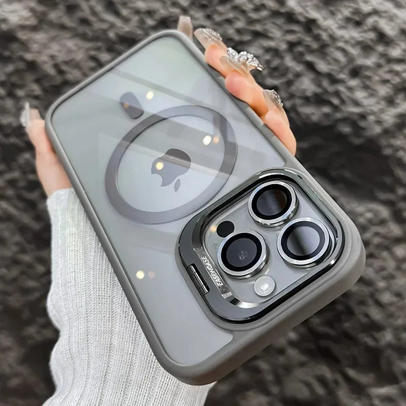 A hand holds a gray magnetic shockproof phone case for an iPhone displaying the Apple logo.