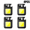 Four compact COB keychain flashlights with magnetic bases and rechargeable batteries shown in black.