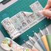 A precision craft knife set with various blades and tools is shown on a cutting mat next to colorful paper and pens.