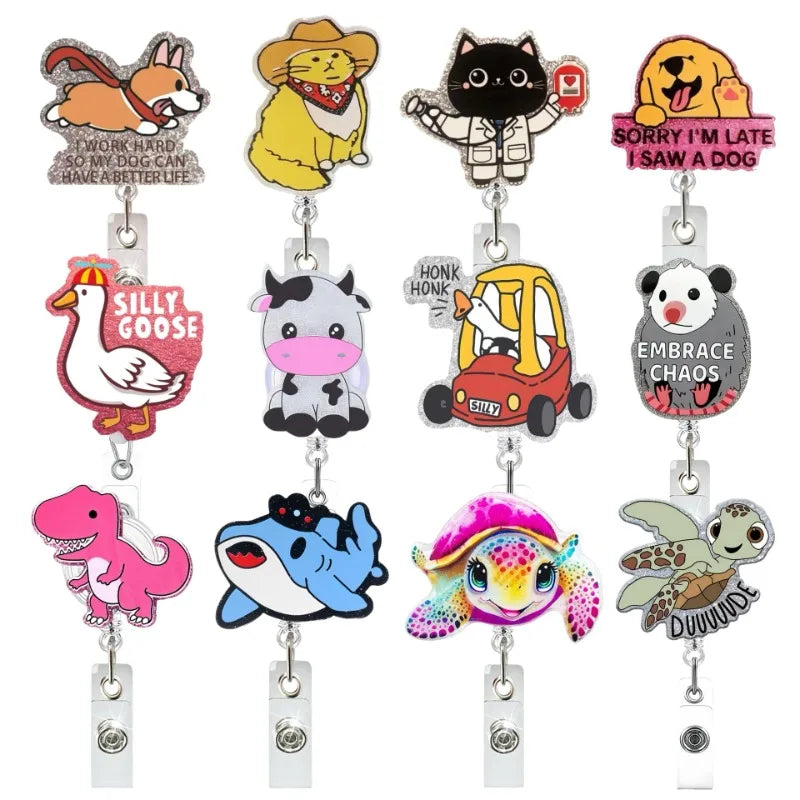 A set of colorful animal-themed badge reels featuring various cartoon characters.