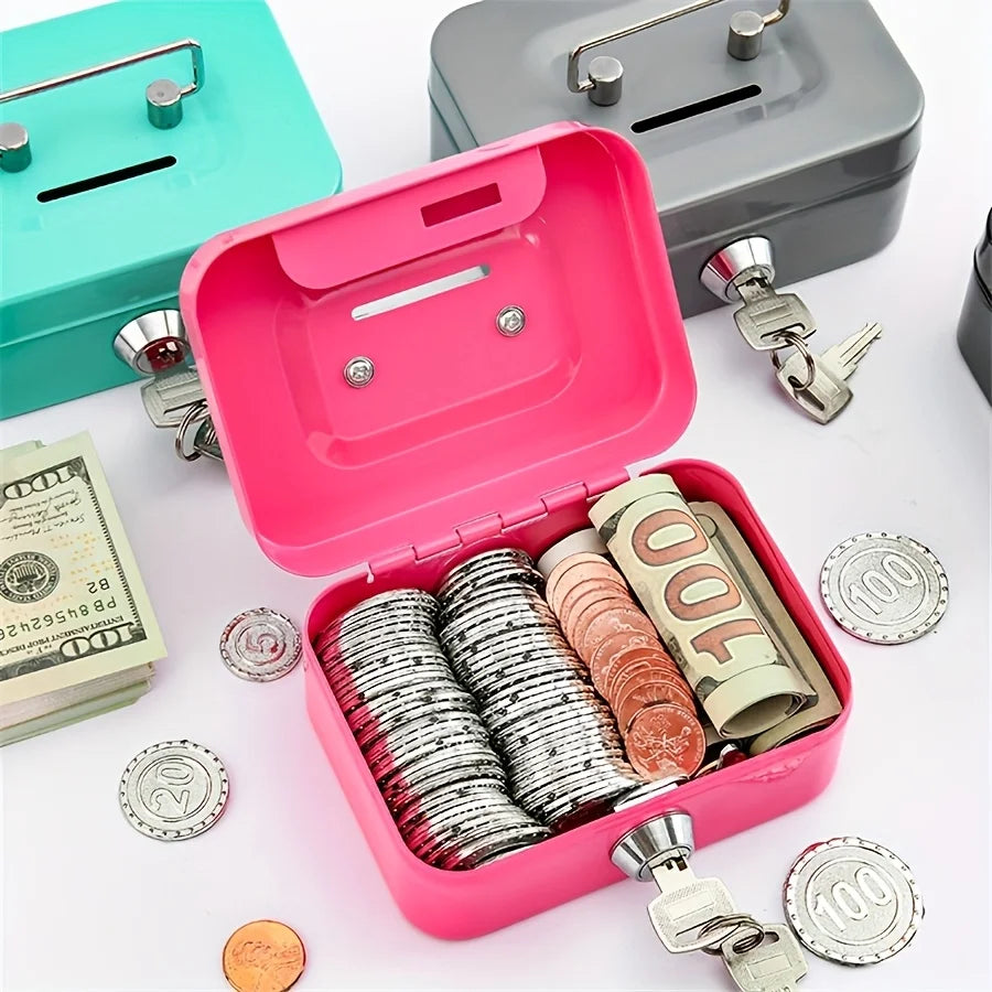 A pink steel cash box with a key lock and removable tray is shown alongside various coins and keys.