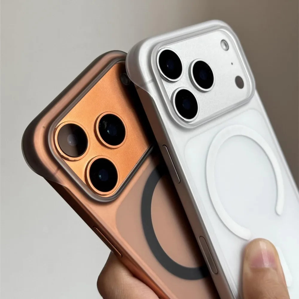 A hand holds two slim magnetic phone cases for iPhone Magsafe, one copper and one white.