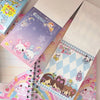 A collection of colorful decorative memo pads featuring cute characters and patterns.