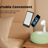 A white magnetic pillow stand holding a smartphone and a tablet on a wooden surface.