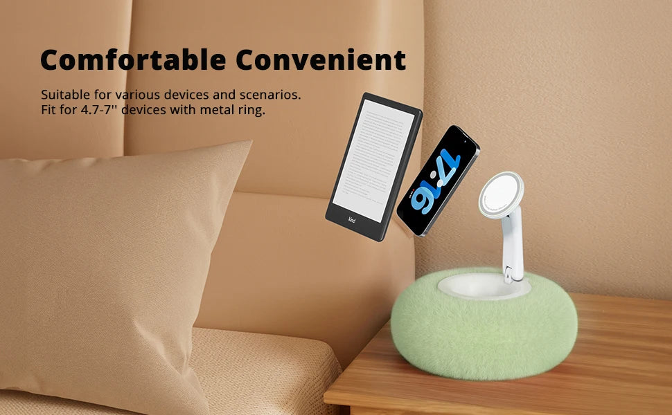 A white magnetic pillow stand holding a smartphone and a tablet on a wooden surface.