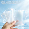 A hand holds a stack of ultra clear card sleeves, demonstrating their protective and scratch-resistant qualities.