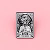 A black and white tarot card design featuring a skull and roses, labeled The Mom.
