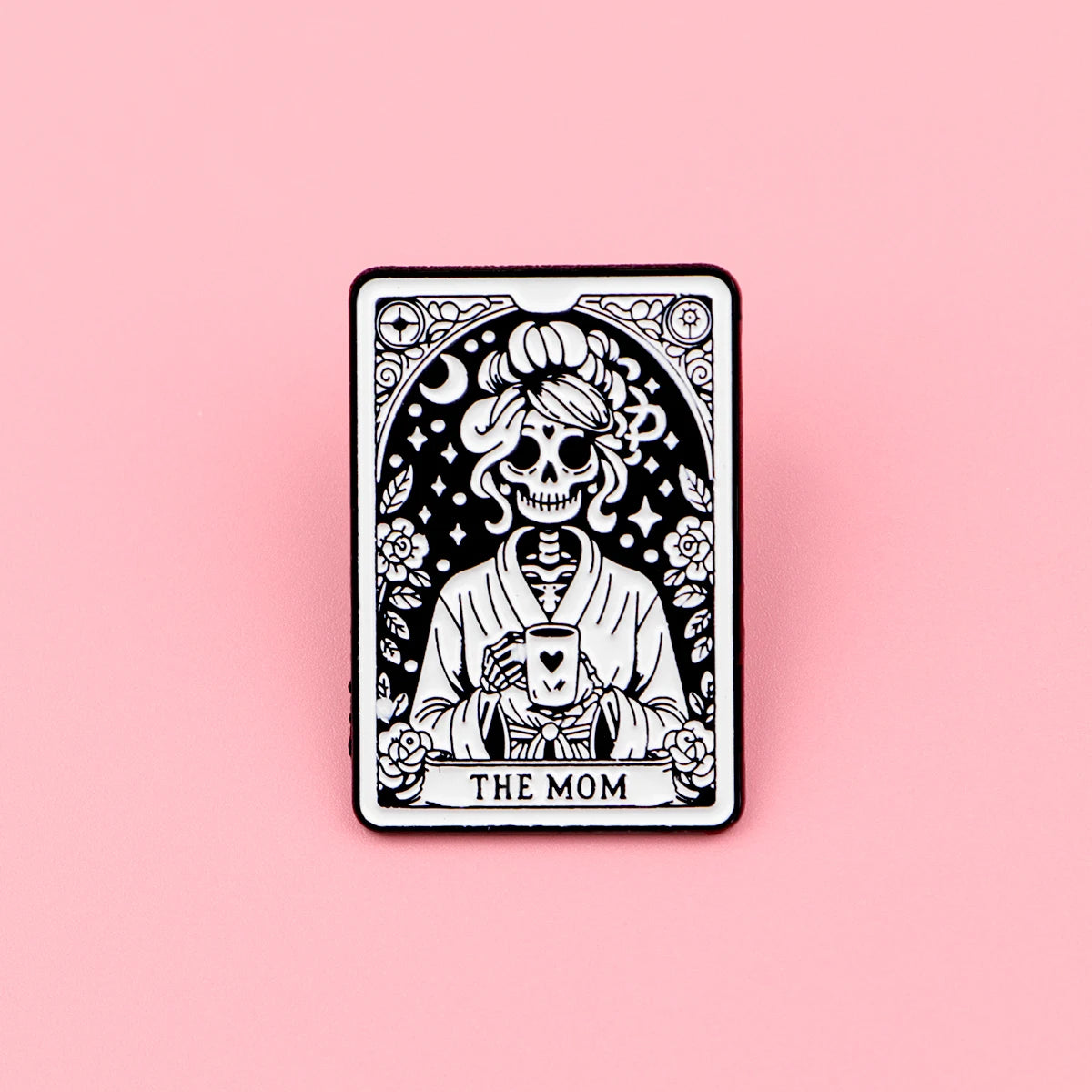 A black and white tarot card design featuring a skull and roses, labeled The Mom.