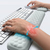 A hand rests on an ergonomic keyboard and mouse with a soft wrist rest pad for comfort.