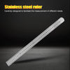 A stainless steel ruler showing markings up to 40 cm, laid diagonally on a dark surface.