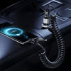 A black cable with a coiled connector is shown connecting a smartphone to a device for data sync and charging.