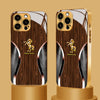 A golden horse wood grain tempered glass phone case for an iPhone displayed on a stand.