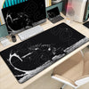 Black gaming mousepad featuring a white design of Miyamoto Musashi from the Vagabond manga