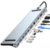 Estación de acoplamiento de 12 en 1 plateada con múltiples puertos, incluyendo USB 3.0, ranuras para tarjetas SD y conectores