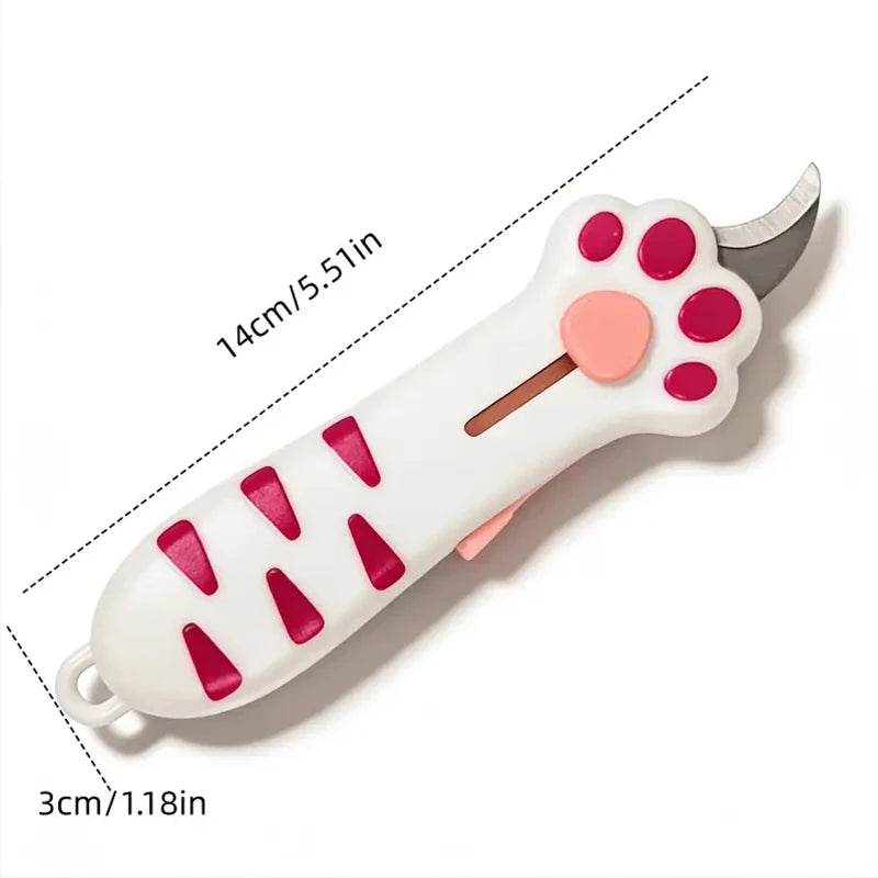 A white retractable cat paw utility knife with pink accents and a silver blade.