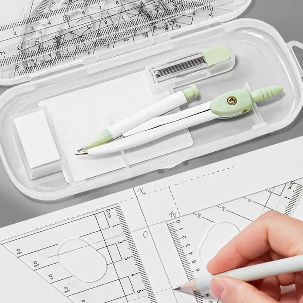 A precision set of transparent measuring tools is shown inside a clear plastic case with a ruler and a pen.
