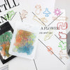 A collection of colorful decorative bookmarks and paper clips in various shapes and colors arranged on a white background.