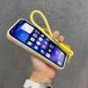 A hand holds a smartphone in a beige case with a yellow lanyard attached.