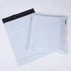 A stack of ten white self-sealing waterproof shipping bags with black seals.