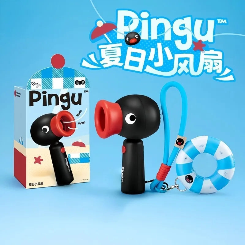 A black Pingu penguin rechargeable handheld fan with a rotating red head and a blue ring is shown against a light blue backgr