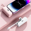 A pink portable power bank shell and a smartphone displaying a battery percentage on a light pink background.