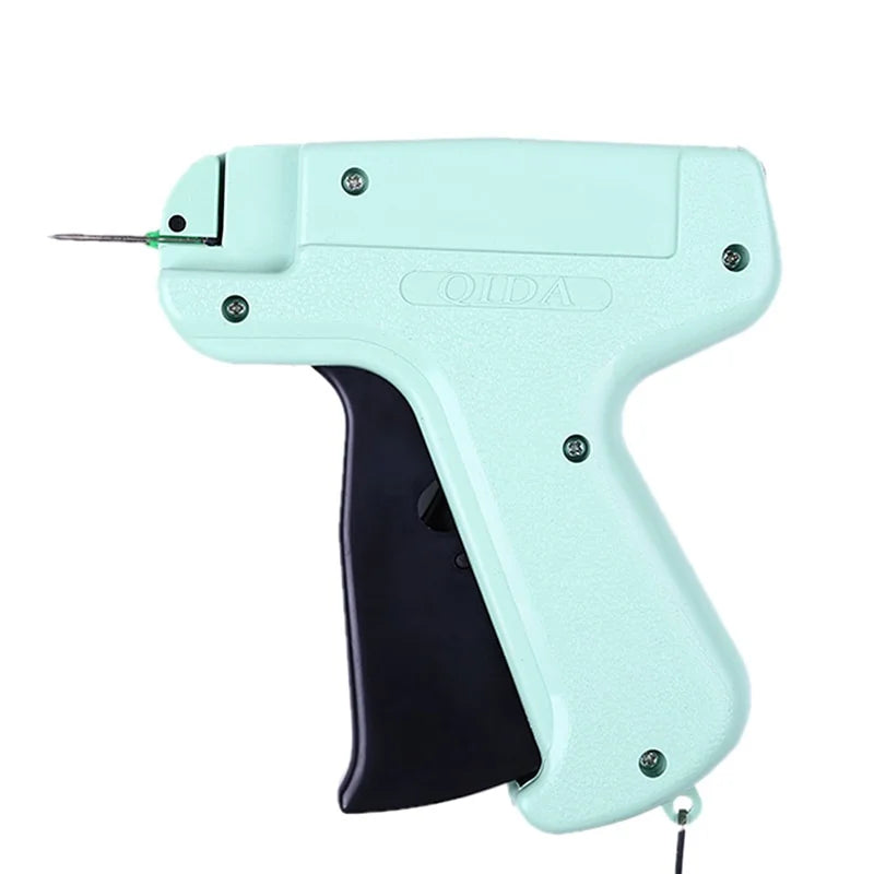 A light mint green professional apparel tagging gun with a black grip and a needle tip.