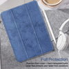 A blue silicone screen protector with a clear back is shown on a gray fabric surface next to a white stylus.