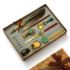A luxury fountain pen set with a wax seal kit displayed in a wooden box.
