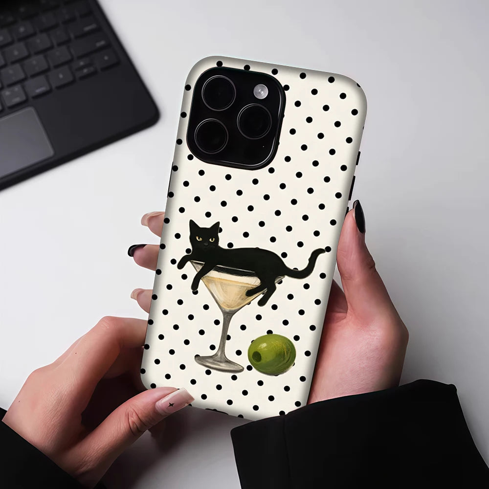 A black cat martini pattern hybrid phone case is held by a person against a light background.
